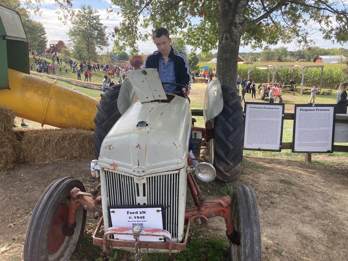 Sample listing photo of a green farm tractor, shown for illustration only